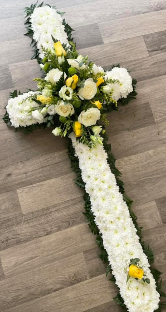 5ft based cross - £125.00 the colours for the spray of flowers can be changed