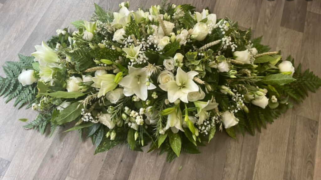 Elegant white rose & lily double ended spray with dried florals added into the design, such as wheat and oats - £200.00 approximately 3ft